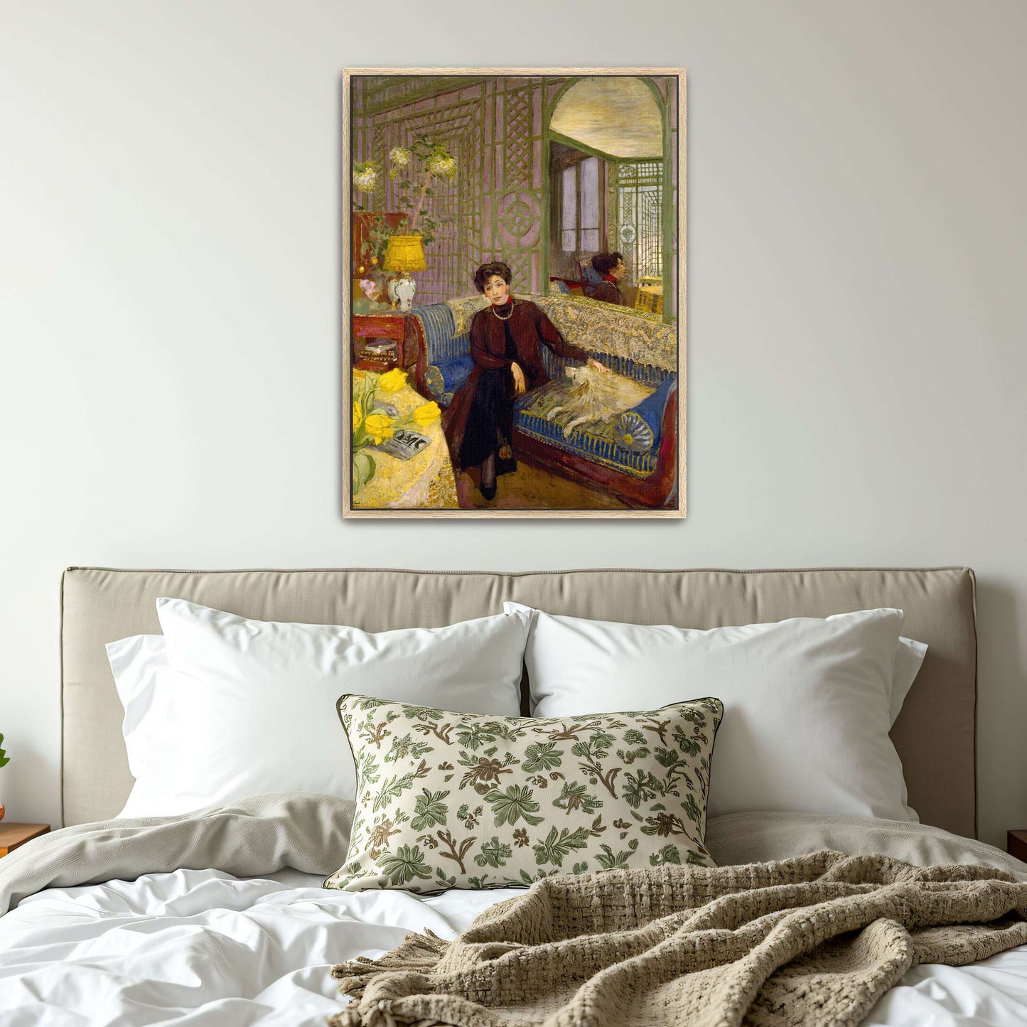 Woman with dog on a blue couch by Édouard Vuillard