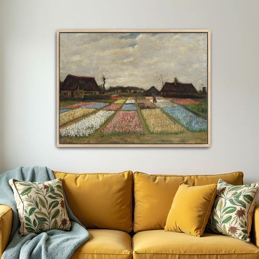 Flower Beds in Holland by Vincent van Gogh as an oak-framed canvas print above a yellow sofa