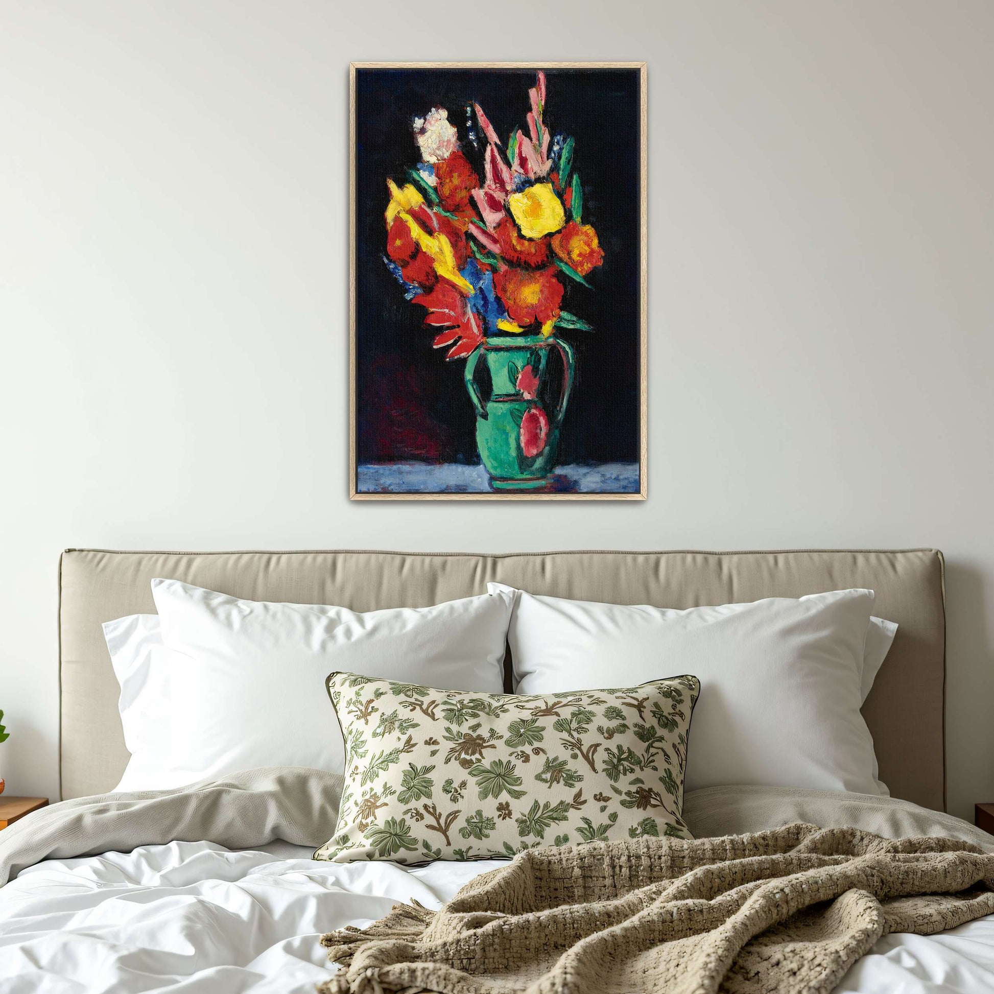 Vase of colorful flowers by Marsden Hartley