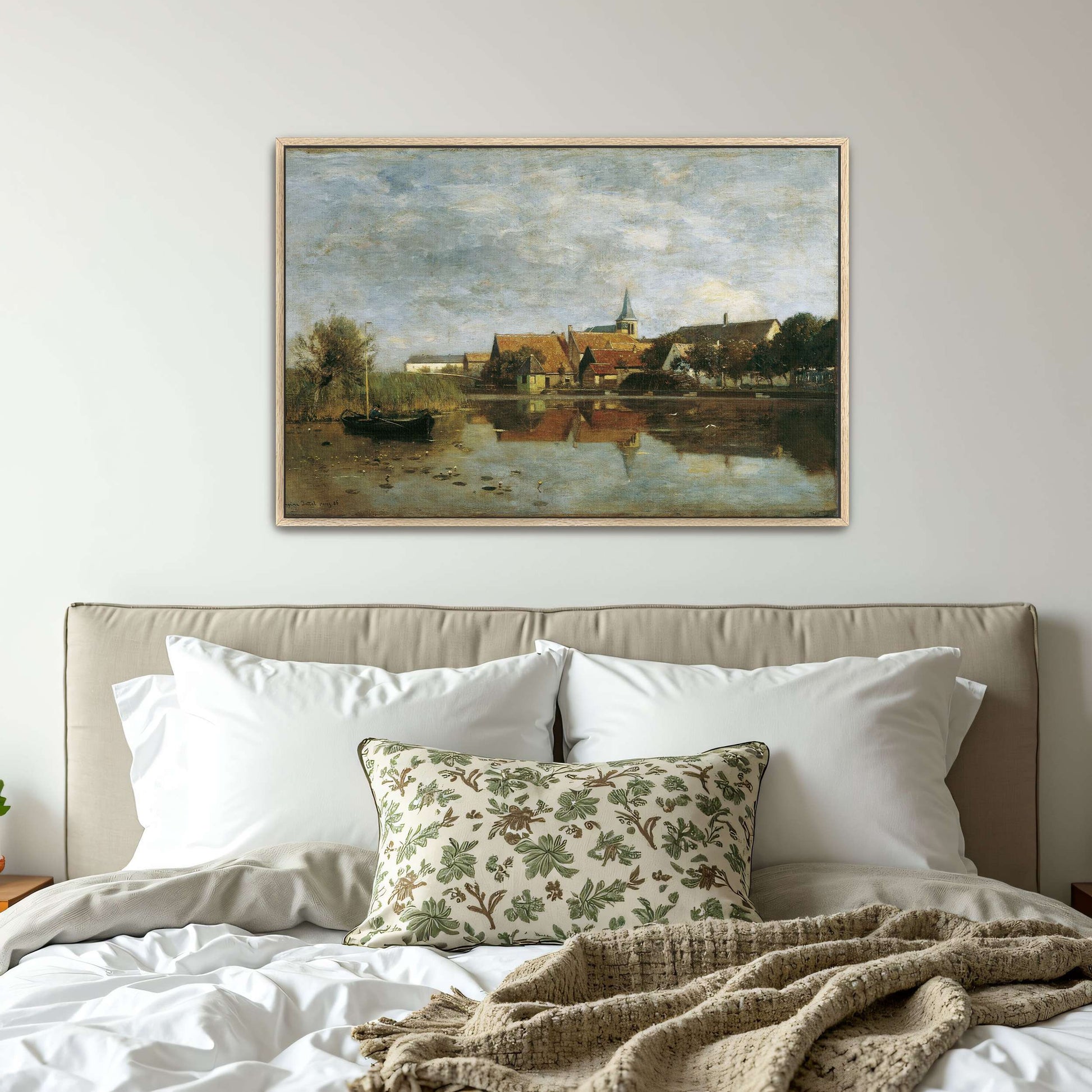 A village by a lake with a boat by Eugen Jettel