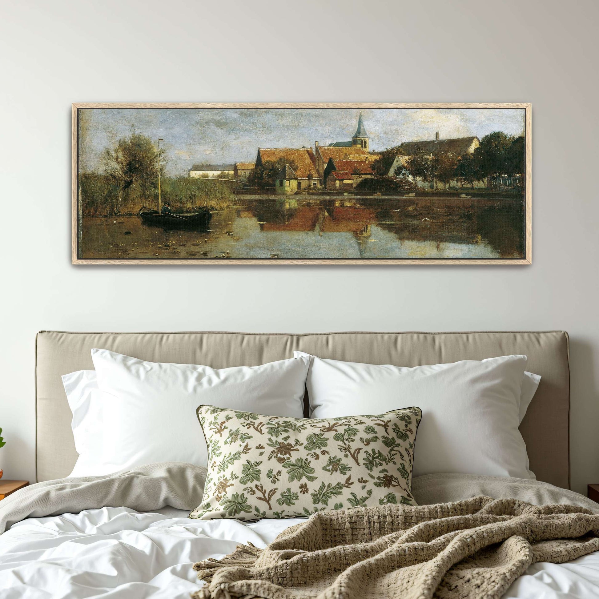 A village by a lake with a boat by Eugen Jettel