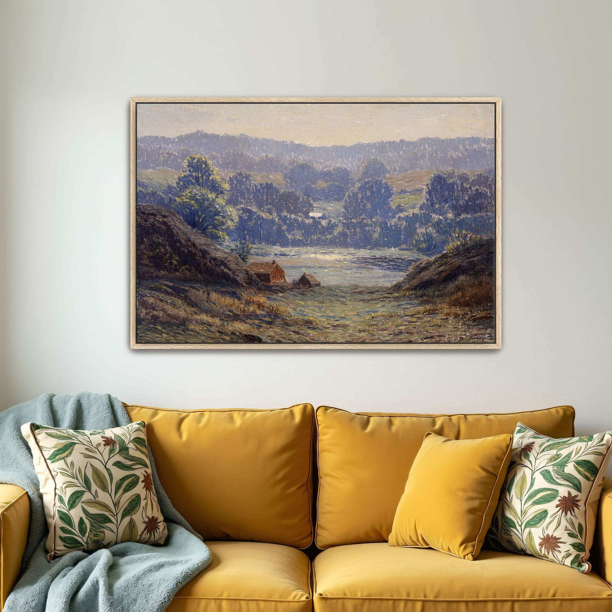 A landscape with a house in a valley by Leonard Ochtman