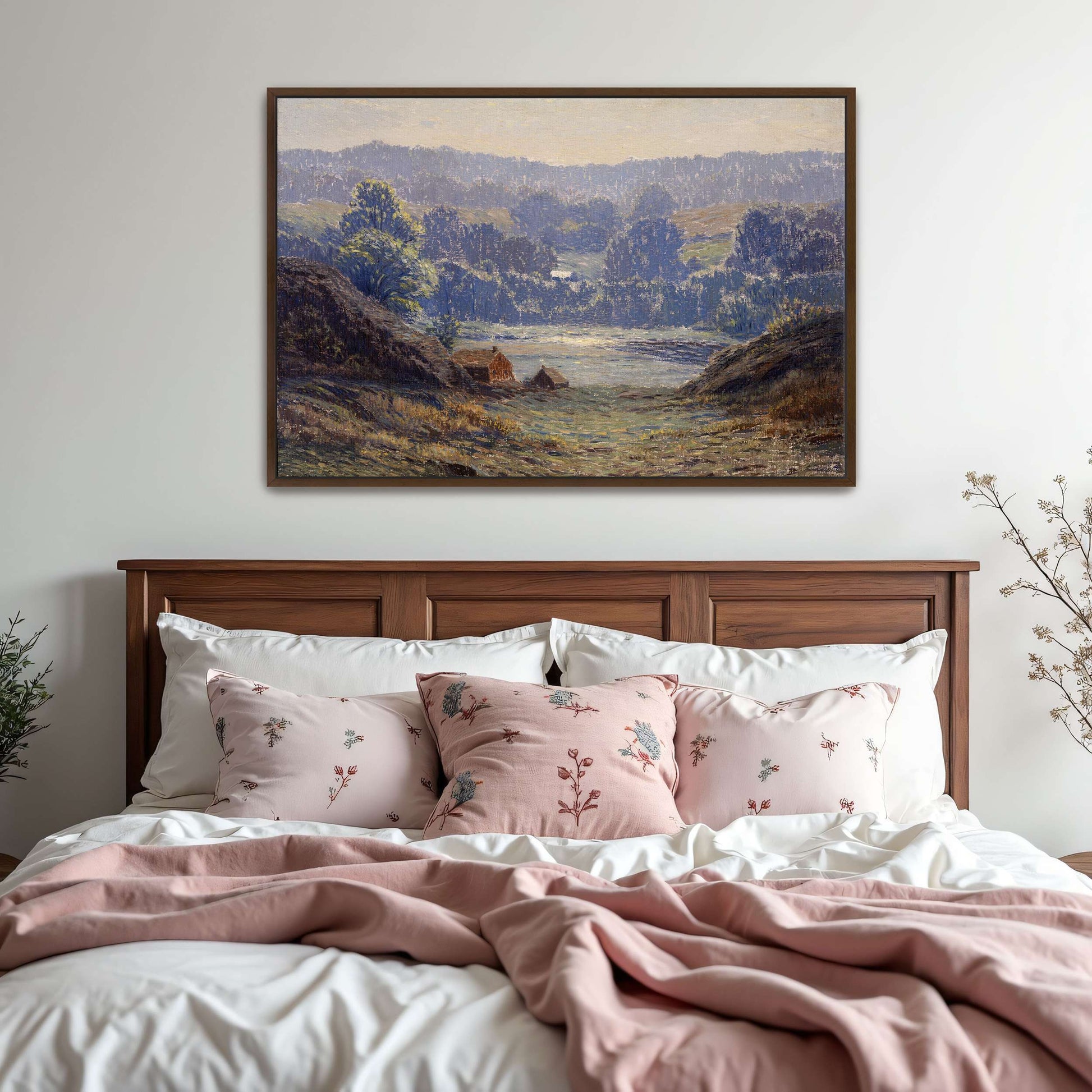A landscape with a house in a valley by Leonard Ochtman